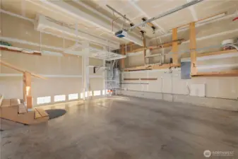 The large 2-car garage is extra high allowing for overhead storage.