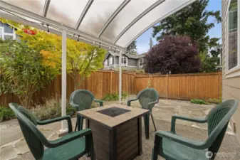 The covered patio is right off the kitchen and family rooms. Perfect for 3 season entertaining and dining al fresco!