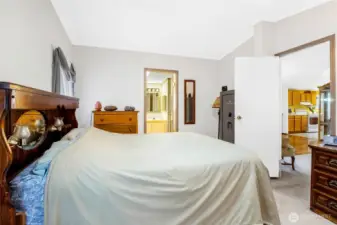 Another view of the primary bedroom. Living room is through the door on the right, and the bathroom is through the door on the far wall.