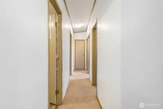 The three other bedrooms are down the hall from the family room.  Laundry/utility room is through the first door on the left.