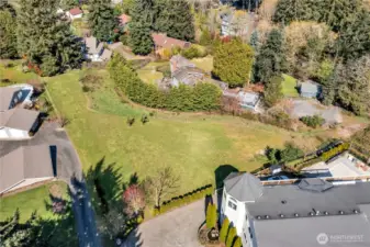 The lot has a slight slope. As far as we know, all homes to be built will have Sound and Mountain views.