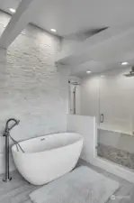 Soaking tub and walk-in shower that features 2 rain heads!