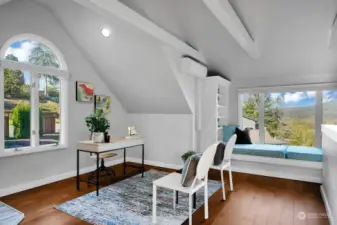 Another view of the office/library  with it's bookshelves, and charming window seat reading nook