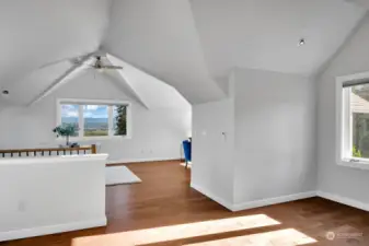 Another view of the bonus room with staircase access.