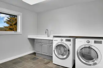 There is a big laundry room/ three-quarter bath on the main floor--LG washer and dryer are included.