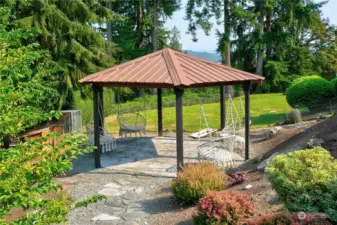 The infrastructure of this yard is amazing! This is the charming gazebo, perfect for your summer parties.