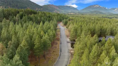 Paved street with utilities in the ground at property