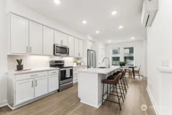 Light & bright kitchen with oversized island: Colors and features will Vary- marketing purposes only