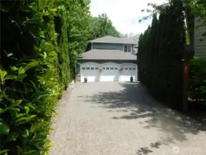 Long driveway to Entrance featuring 3 car garage!