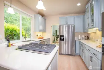 Kitchen with new Gas top Cooking.