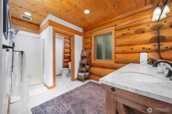 Private water closet and walk in show are showcased in the primary ensuite.