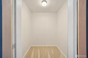 Primary bedroom walk in closet