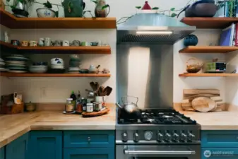 All newer appliances and open shelving help keep this kitchen nice and bright.