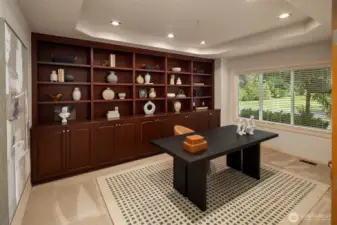 Large main level Den with built ins and front garden view.