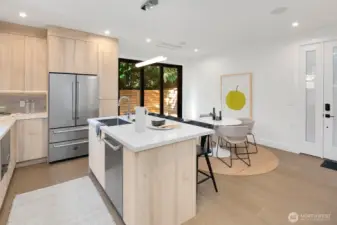 The main entrance is the door on the right. There is a recessed minisplit. The sliding glass "wall" takes you to a private, fenced backyard with patio.