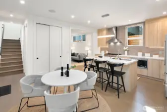 Open concept living and dining space. Stairs lead up to the two bedrooms on the upper level.