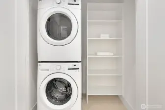 Home comes with a stacking washer/dryer.