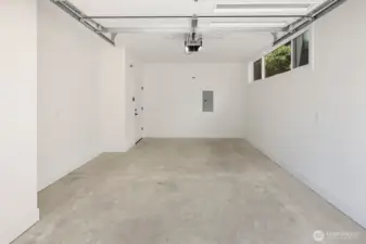 Carriage house has a fully finished 1-car garage.