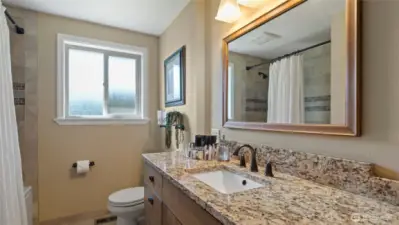 The full hall bath features a large soaking tub.