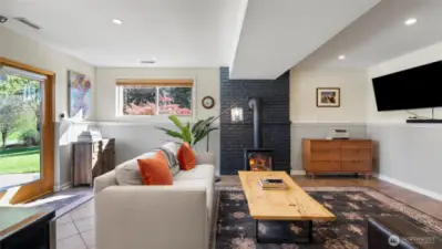The walk-out lower level living area/media room is cool in the summer and, thanks to that gas stove, cozy in the winter.