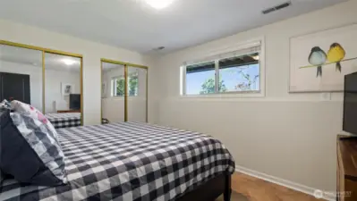 Lower level bedroom features double closets (shown with king bed).