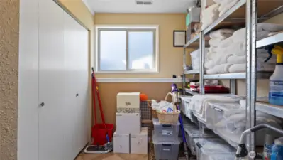 Mechanical room with loads of storage could also be converted to a second kitchen, if desired.
