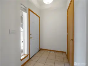 The entry has tile flooring for durability and easy cleaning.