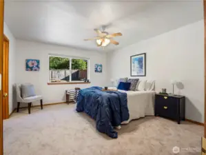 The primary bedroom is oversized and has its own en suite. It also have a view of the back yard.