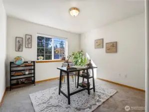 The smalles of the two bedrooms are still good size. Here staged as an office.