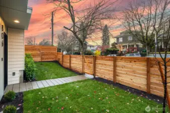 Home is street facing with a fully fenced and level front yard.