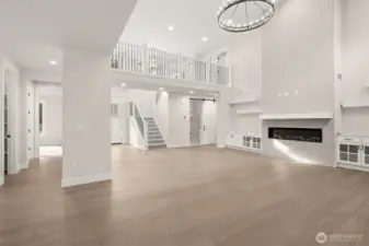 Stunning great room with soaring ceilings and gas fireplace