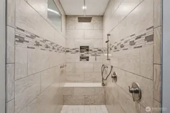 Large walk-in double shower in the remodeled primary bathroom.