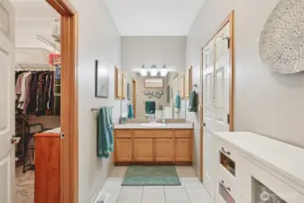 Remodeled primary bathroom with updated finishes, walk-in closet, and heated floors.