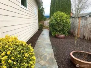 Stone walkway behind the garage.