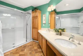 Primary suite bathroom with walk-in shower.