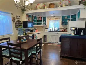 open floor plan in a remodeled Victorian home with laminate flooring