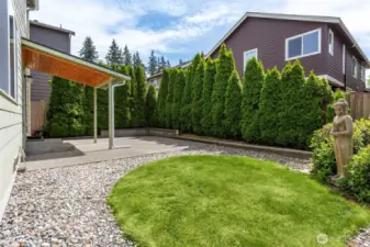 Nice sized yard with attractive landscaping and shrubs