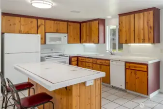 Real wood cabinets, all appliances stay.