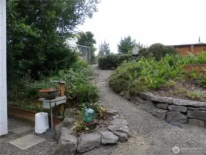 This path going west leads you up to the elevated section of the property where RV will be.