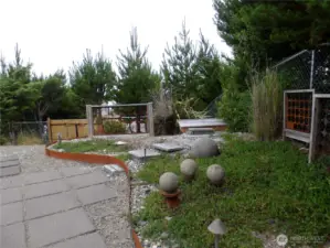 This landscaped area has a small deck that looks west towards the ocean.