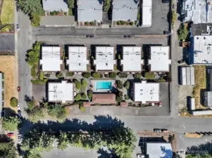 Here’s an aerial view showing the spacious layout and community features. Among the seven buildings, your new home is nestled in the upper left-hand corner, ready to welcome you.