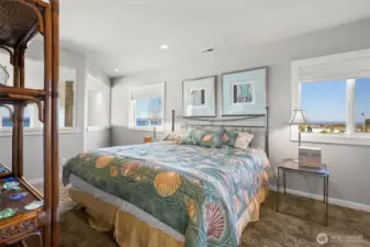 The first upper bedroom, with room for a king sized bed (pictured is a queen)