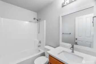 Shared bath with updated quartz counters, fixtures and sink