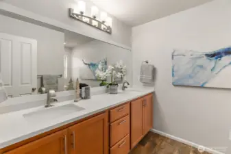 Ensuite five piece primary bath with updated quartz counters, undermount sinks, hardware