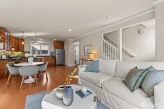 Generously sized open-concept living, dining and kitchen areas