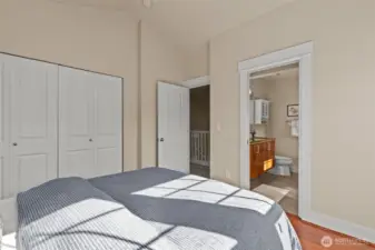 South-facing bedroom with vaulted ceilings and en suite bathroom