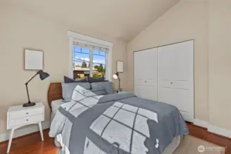 South-facing bedroom with vaulted ceilings and en suite bathroom