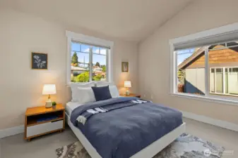 Second bedroom with vaulted ceilings and en suite bathroom