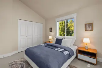 Second bedroom with vaulted ceilings and en suite bathroom