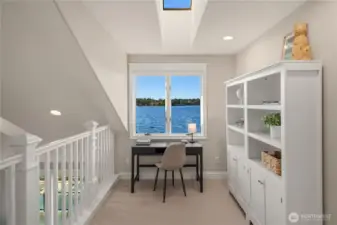 The bright sunny loft is the ideal place to read a book while peering out to the lake.